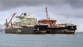 Carrying a 5,500&nbsp;t (6,100-short-ton) test platform in the bow slot (Aug 2016)[25]