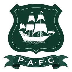 Plymouth Argyle's crest: The initials " underneath a shield featuring a ship called the Mayflower in full sail.