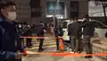A large number of police officers pulled up the orange cordon tape and asked reporters and citizens to leave the pavement outside the court.