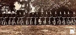 Reproduction of old photograph of policemen with bicycles. Seventeen Cornish police officers of various ranks with their bikes in, 1913