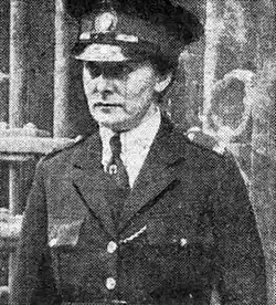 Photograph of Moss in uniform outside court