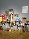 Placards inspired by Poor People's Campaign posters created by USF students, faculty, and staff in a workshop on November 4, 2022. Displayed in USF Contemporary Art Museum's 2023 exhibit "Poor People’s Art: A (Short) Visual History of Poverty in the United States."