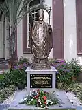 Statue of the late Pope John Paul II on the grounds of the cathedral.