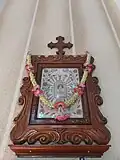 The portrait of St. Thomas is venerated here was brought from the Carmelite Monastery Mannanam in 1897 by "Albhutha Mathai", pursuant to a revelation. This portrait is mounted in a decorated waft of great artistic value.[6]