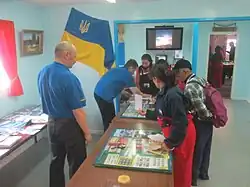Tourists visit the post office inside Vernadsky Station.