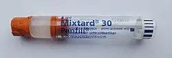clear glass tube labelled Mixtard 30 containing a cloudy white liquid