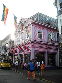 A pink building with rainbow pride flags