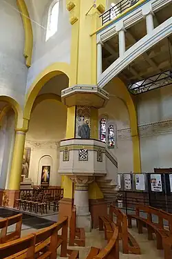 The pulpit, made of concrete and decorated with mosaics
