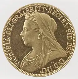 A gold coin with a profile view of an older Queen Victoria, facing left