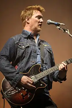 Josh Homme performing in 2011