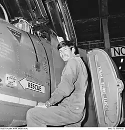 Black and white photo of a man with an aircraft