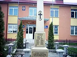 Dumbrăveni town hall and war monument
