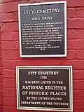 Plaques in front of the cemetery