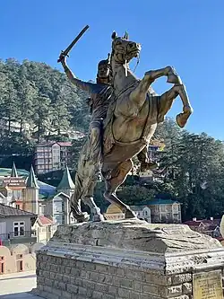 Statue of the Rani of Jhansi armed with a sword astride a rearing horse