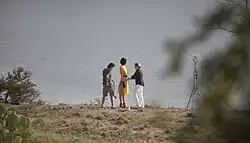 Model Raquel Zimmermann standing on the rim of Yellow House Canyon.