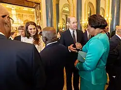 Dougan conversing with Prince William and Princess Catherine of Wales during a Commonwealth Realms Coronation Event at Buckingham Palace, 2023.