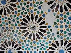 Zellij with 16-pointed star motifs in the Mexuar of the Alhambra in Granada (14th century; with later Spanish emblem inserted in the center)