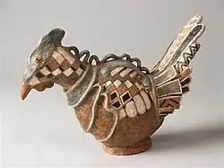 Image of a fantasy bird decorated with white-yellow color fields and a garland over the back (1960)