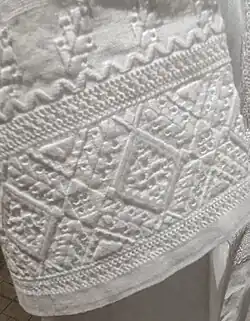 A white sleeve with a white ornament