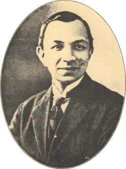 Head-and-shoulders portrait of a Eurasian gentleman in a suit