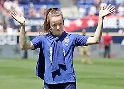 Rose Lavelle waving to fans.