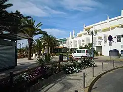 Part of the Commercial area on the Rua Ramalho Ortigao behind the middle section of Praia da Oura.