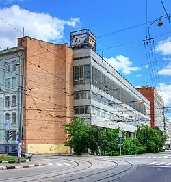 Old factory on a street with trolley tracks