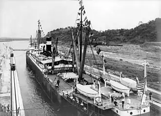 The first ship to transit the canal at the formal opening, SS Ancon, passes through on 15 August 1914.