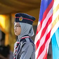 A Malaysian Girl Scout wearing a forage cap at the parade during the celebrations of Hari Merdeka 2013.