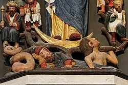 Below the Virgin Mary we see the branches of the Tree of Jesse