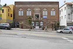 Exterior of the Chinatown Branch Library, showing the dual staircase entrance