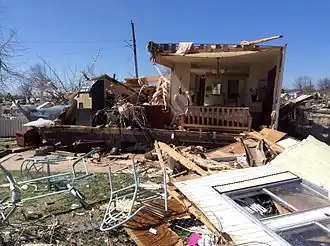 An image depicting the remains of a destroyed double-wide mobile home in Sand Springs, Oklahoma.