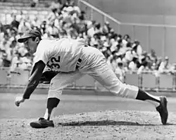 A baseball player, Sandy Koufax of the Dodgers, pitching during a baseball game.