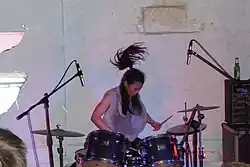 Sayaka Himeno on drums for Nisennenmondai in 2009