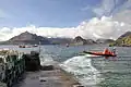 Image 1A boat leaving a slipway stacked with creels in Elgol Bay, Skye, with the Cuillin in the background Credit: Paul Hermans
