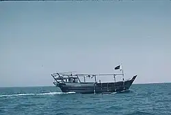 A diver swimming through a dark cave.