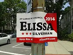 A red and white sign with the name "Elissa" large and in black.