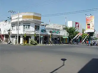 Street view in Singaraja, Bali, with a Djarum Super Compact Size advertisement in the far right, captured in 2005