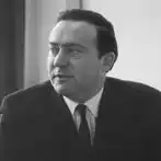 A head and shoulders portrait of Sir Ronald Halstead. He is glancing to his right.