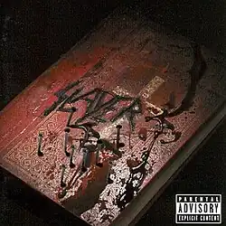 A Bible spiked with nails placed in a pentagram star shape covered in blood with the word "Slayer" burnt across it.