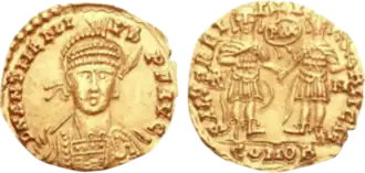 Solidus of Anthemius – RIC X 2804. AD 467–472. Rome mint. Struck AD 471–472. D N ANTHEMI-VS P F AVG, pearl-diademed, helmeted, and cuirassed facing bust, holding spear in right hand, on left arm a shield decorated with horseman motif / SALVS REI-P-V-BLICAE, Anthemius and Leo I, holding Victory on globe in right hand, standing facing, clasping hands; between them PAX within wreath surmounted by cross; R-M//COMOB.