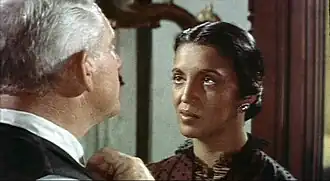 Black and white film still showing Spencer Tracy and Katy Jurado together