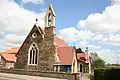 St Barnabas Church, Ranskill, Nottinghamshire, 1878 by Ewan Christian, in stone with a bellcote[165]