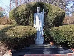 Statue of St. John the Baptist (made in Italy) in front of the outside fountain