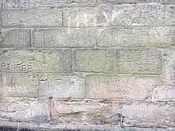 Inscribed graffiti on the north wall