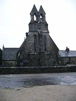 The end of a church with a twin bellcote