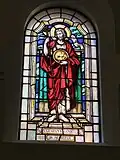 Stained-glass window depicting St John the Baptist