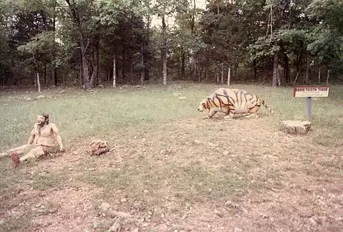 Caveman and a saber-toothed cat (1988 photograph).