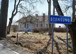 Sign presumably at entrance of town.