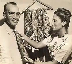 Stephen and Ayne Sacklarian with hand-painted ties at artist exhibition